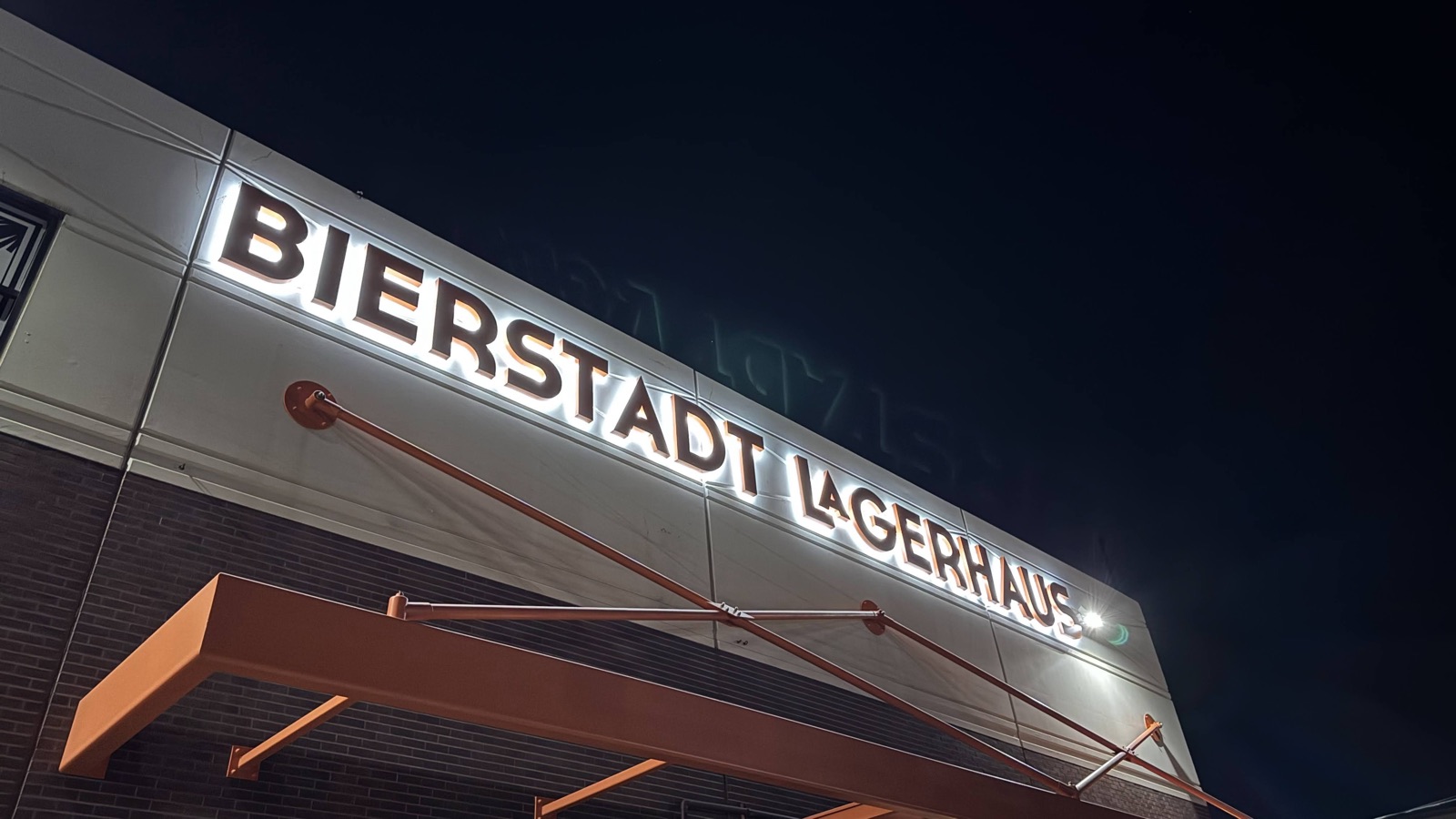 Illuminated Bierstadt Lagerhaus sign at night